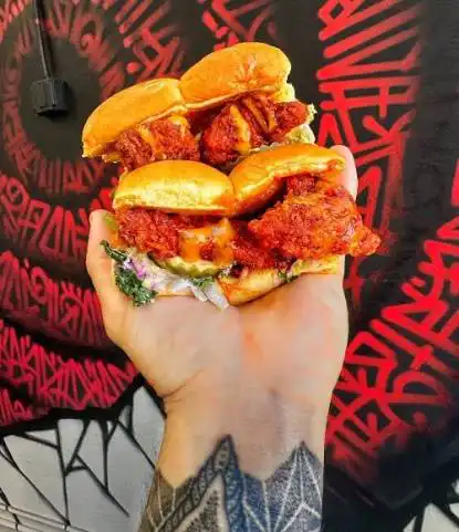 Dave's Hot Chicken sliders and tenders showing calories per serving.