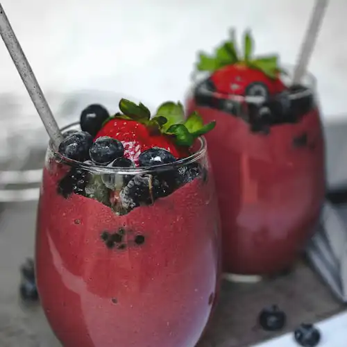 Mixed berry smoothie with fresh fruits.